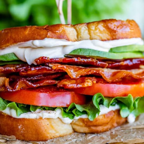 A Java House BLT sandwich with crispy bacon, fresh lettuce, sliced tomatoes, avocado, and mayonnaise.